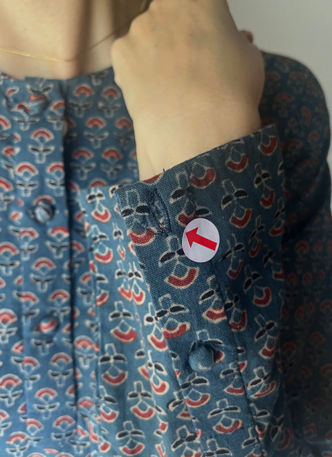 左袖口　ボタンホール不良